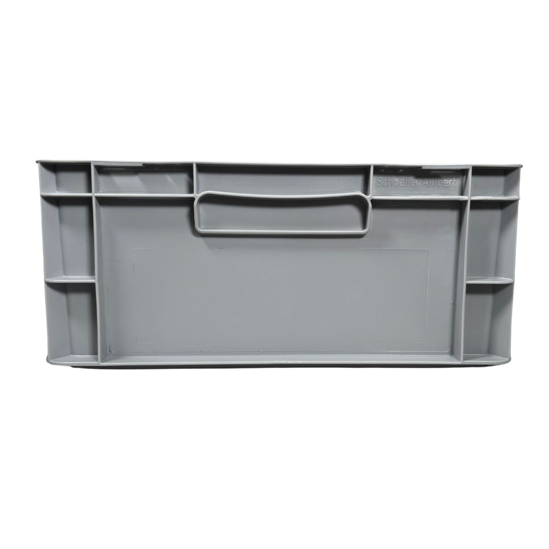 Visión del lateral estrecho de la caja de almacenaje de plástico gris Eurobox (400x300x175mm), destacando su diseño liso y apilable (Ref 76031 Fijaplast)